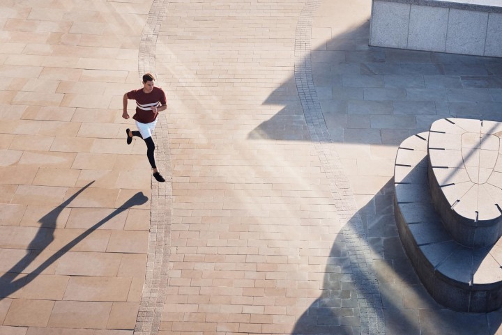 Iffley Road running wear photo by Ben Harries. Model wearing Cambrian Stripe Maple Track White T Shirt, Hampton Dover White Shorts and Royston Gravel Leggings